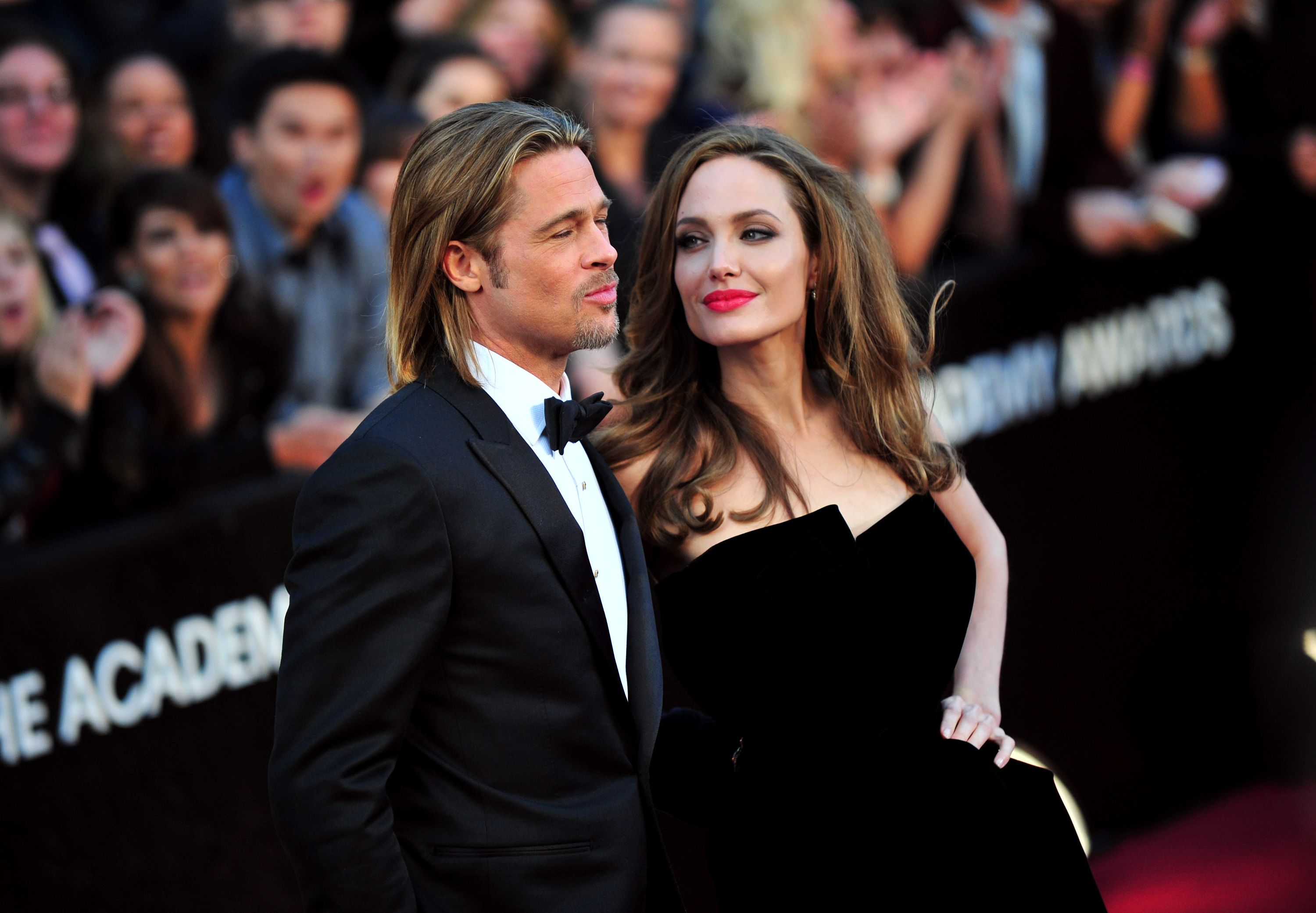 Brad Pitt and Angelina Jolie arrive on the red carpet at the 84th Academy Awards at the Hollywood and Highlands Center in the Hollywood section of Los Angeles on February 26, 2012. UPI/Kevin Dietsch / eyevine Contact eyevine for more information about using this image: T: +44 (0) 20 8709 8709 E: info@eyevine.com http://www.eyevine.com